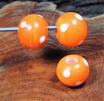 orange bead with dots