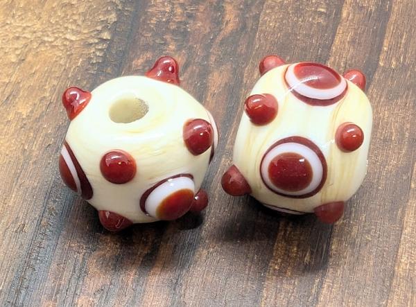 eye bead ivory red brown